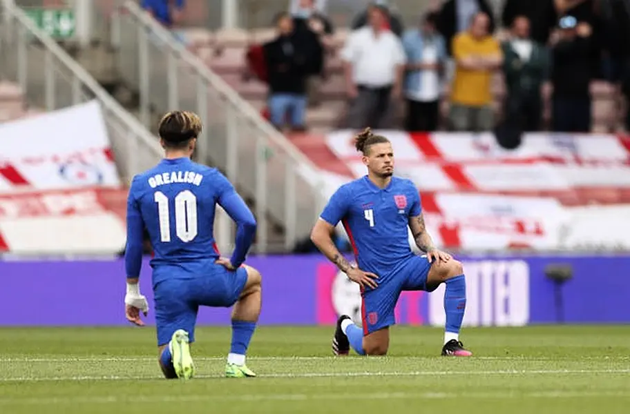 England’s Jack Grealish and Kalvin Phillips take a knee 