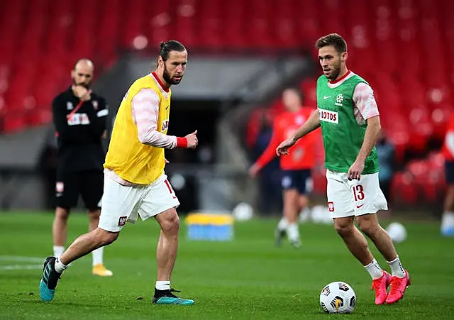 Grzegorz Krychowiak, left, and Maciej Rybus warm up prior to the World Cup qualifier against England at Wembley in March 2021