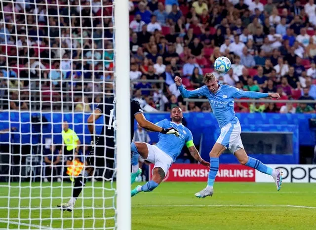Cole Palmer, right, scores Manchester City's equaliser against Sevilla in the UEFA Super Cup