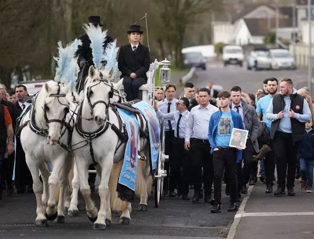 The horse-drawn carriage carrying the coffin of John Keenan 