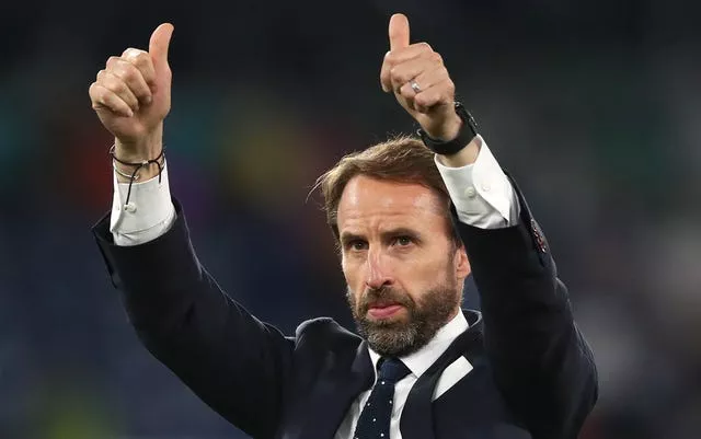 Gareth Southgate puts his thumbs up to the England fans