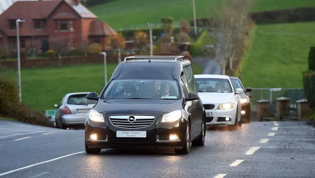 The hearse carrying the coffin of Christopher Mooney arrives at St Patrick’s Church