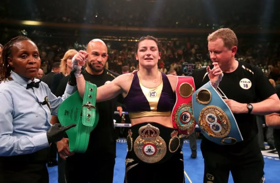 Katie Taylor, centre, is the undisputed lightweight champion (Nick Potts/PA)