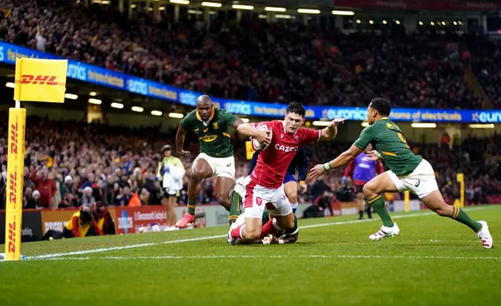 Louis Rees-Zammit is tackled short of the line by South Africa’s Siya Kolisi