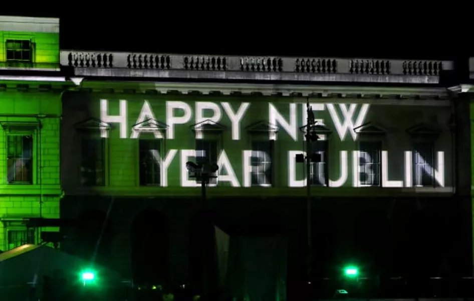 Those gathered at Custom House in Dublin for New Year could little have imagined what lay in store (Brian Lawless/PA)