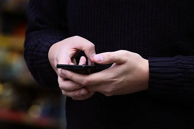 A man texting on a mobile phone