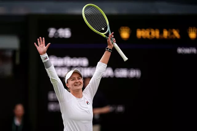 Barbora Krejcikova raises her arms in celebration