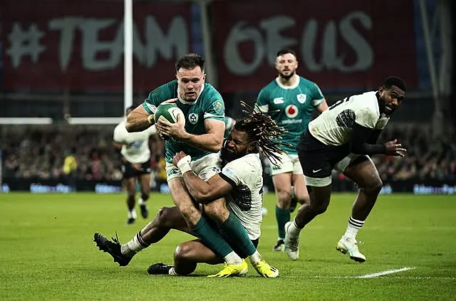 Ireland wing Jacob Stockdale is tackled by Fiji’s Waisea Nayacalevu