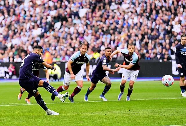 Manchester City’s Riyad Mahrez sees his penalty saved