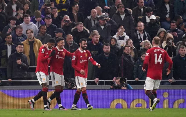 Bruno Fernandes, centre, joins the celebrations after Marcus Rashford, left, scored Manchester United’s second goal against Tottenham