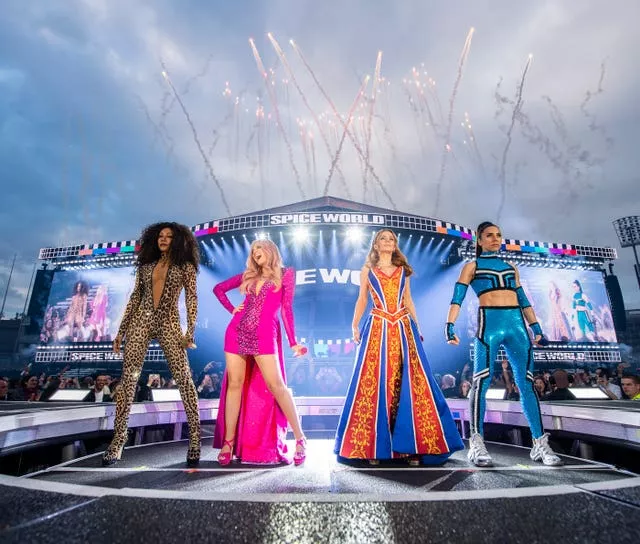 Melanie Brown, left to right, Emma Bunton, Geri Halliwell and Melanie Chisholm on stage