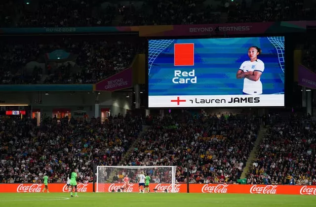 The big screen shows a red card for England’s Lauren James 