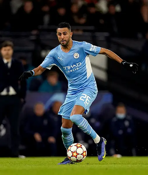 Manchester City’s Riyad Mahrez runs with the ball