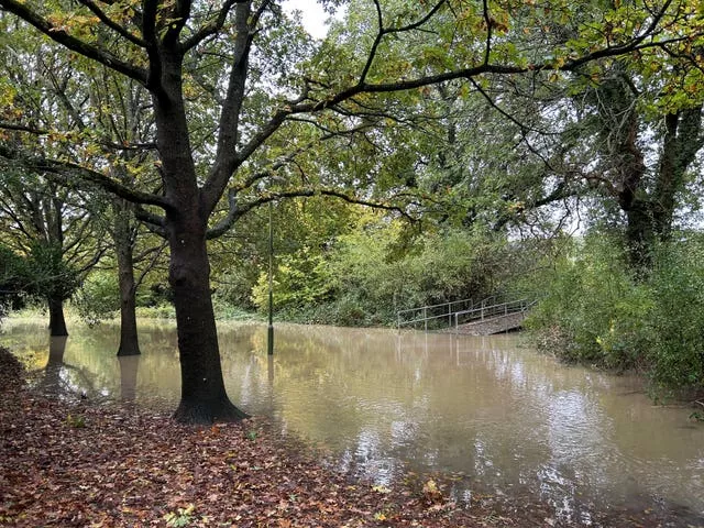A bridge to Tanbridge House School blocked by flood water next to the River Arun in Horsham 