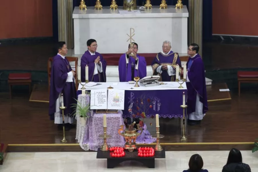 The priest of the Vietnamese Catholic Cathedral in east London, Father Simon Thang Duc Nguyen, performs the service at the mass prayer and vigil for the 39 victims found dead inside the back of a lorry (Yui Mok/PA)