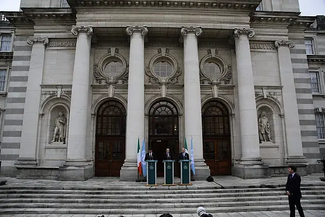 Eamon Ryan, Simon Harris and Micheal Martin at the press conference on Wednesday (PA) Israel-Hamas conflict