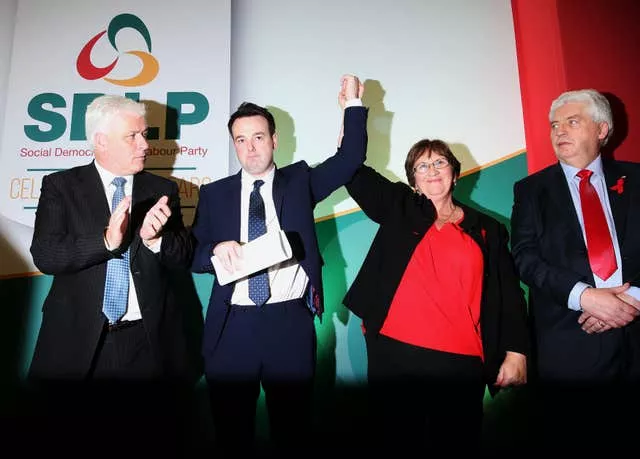 Colum Eastwood's hand being raised in victory after being elected new leader of the SDLP in 2015