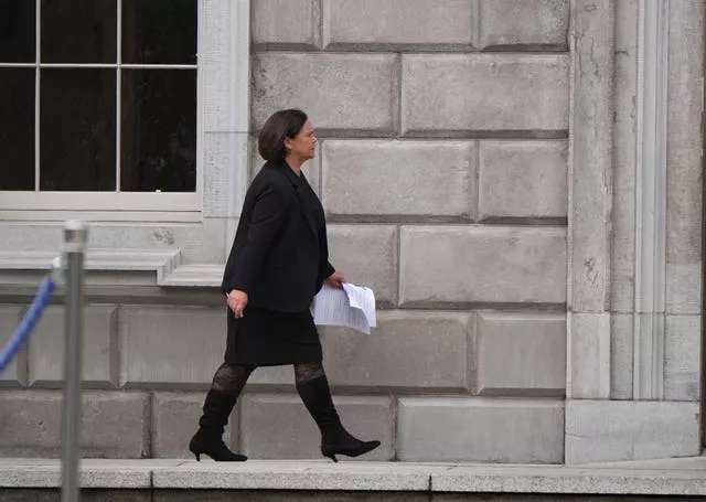 Mary Lou McDonald walking into a building