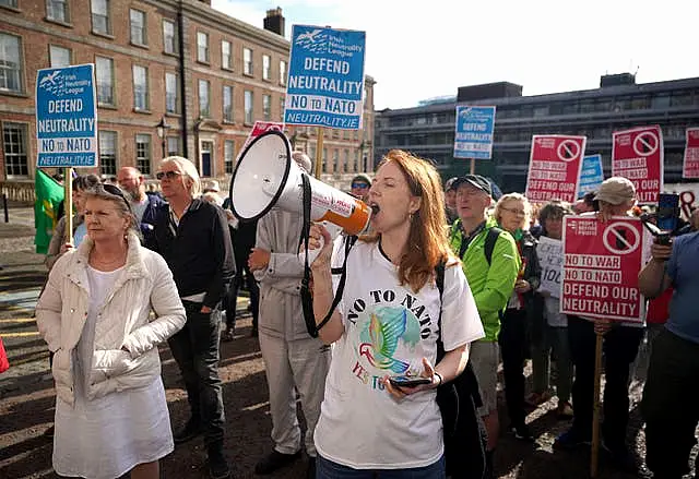 Protestors outside Dublin Castle during the third day of the Consultative Forum on International Security Policy