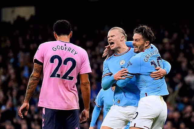 Erling Haaland celebrates with Jack Grealish