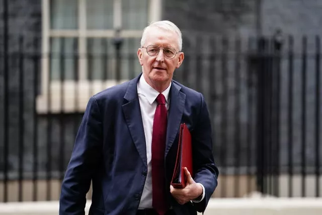 Northern Ireland Secretary Hilary Benn walking in Downing Street