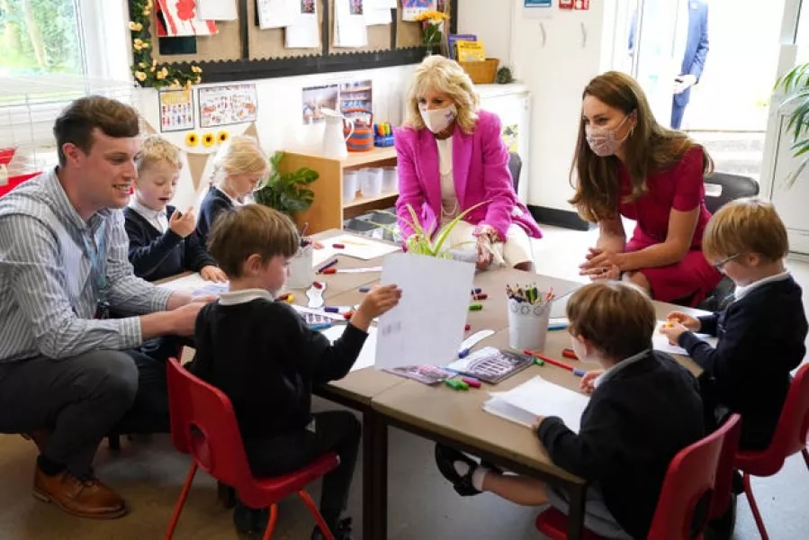 US First Lady Jill Biden (left) and the Duchess of Cambridge talk with children in the school's Reception Class during a visit to Connor Downs Academy in Hayle, West Cornwall, during the G7 summit in Cornwall (Aron Chown/PA)