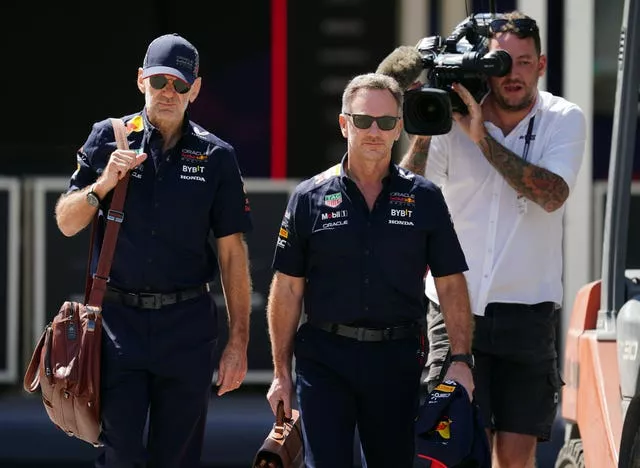 Red Bull Racing team principal Christian Horner and chief technical officer, Adrian Newey arrive at the Bahrain International Circuit