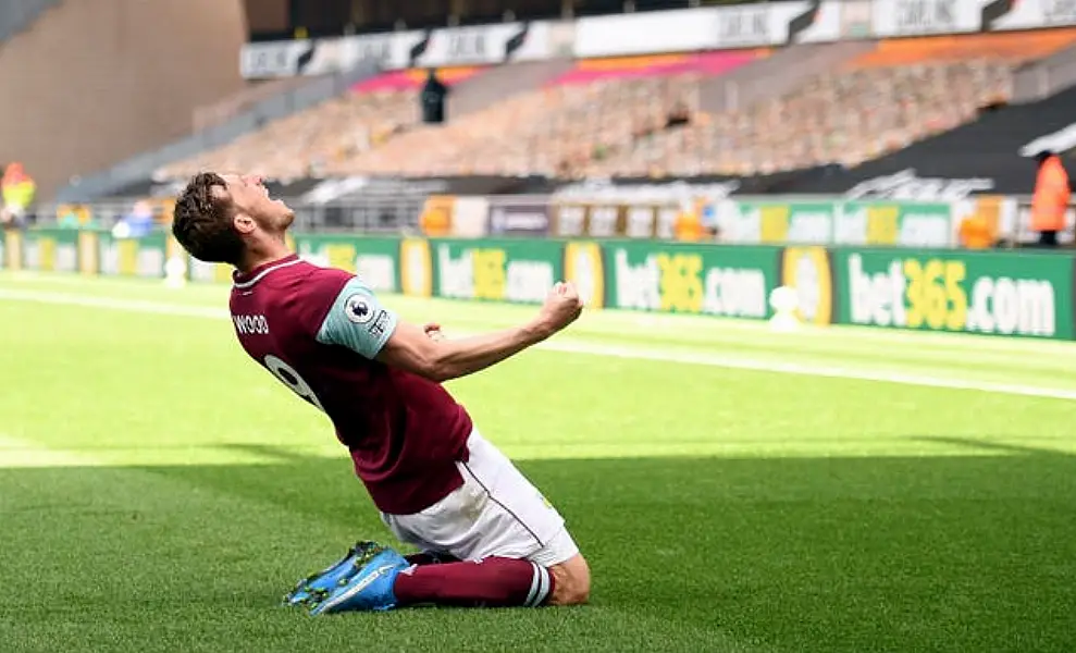 Burnley’s Chris Wood celebrates his hat-trick in a 4-0 Premier League win at Wolves