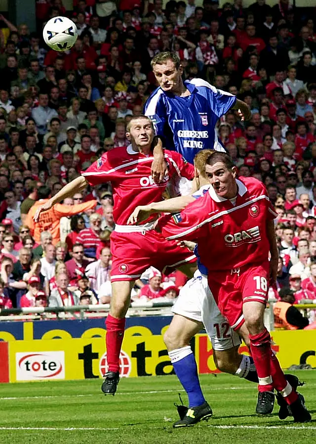 Ipswich's Tony Mowbray (top) scores with a header against Barnsley during the Division 1 play-off final at Wembley