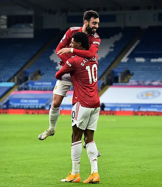 Bruno Fernandes, top, and Marcus Rashford celebrate the latter's goal at Leicester