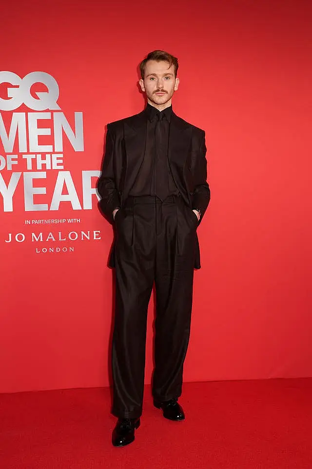 Harry Lawtey attends the GQ Men of the Year photocall at Kensington Roof Gardens