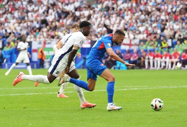 Slovakia’s Ivan Schranz beats England’s Marc Guehi before scoring their side’s first goal