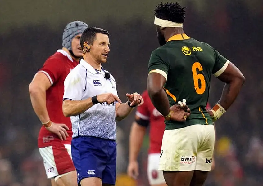 Referee Paul Williams speaks to South Africa’s Siya Kolisi 