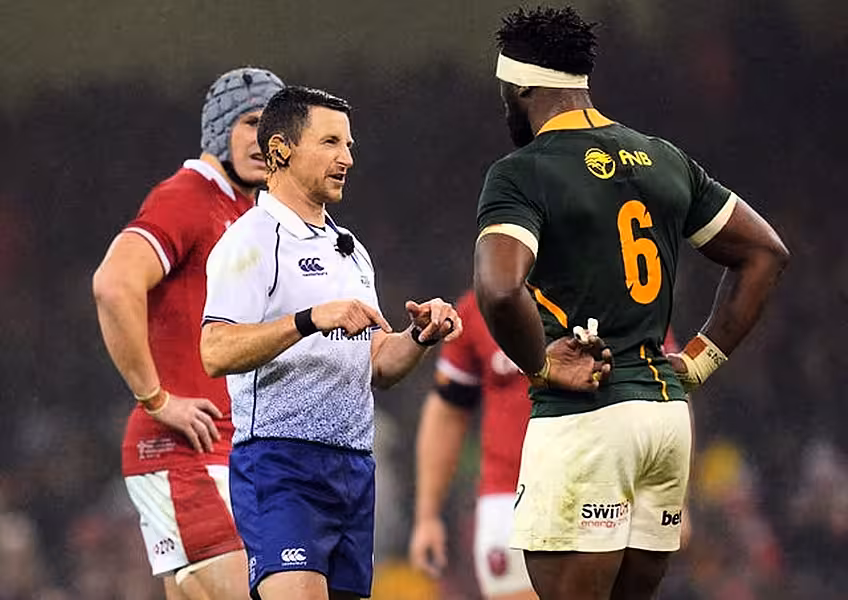 Referee Paul Williams speaks to South Africa’s Siya Kolisi