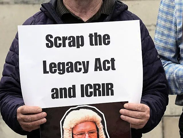 A protester outside the Court of Appeal at the Royal Courts of Justice in Belfast