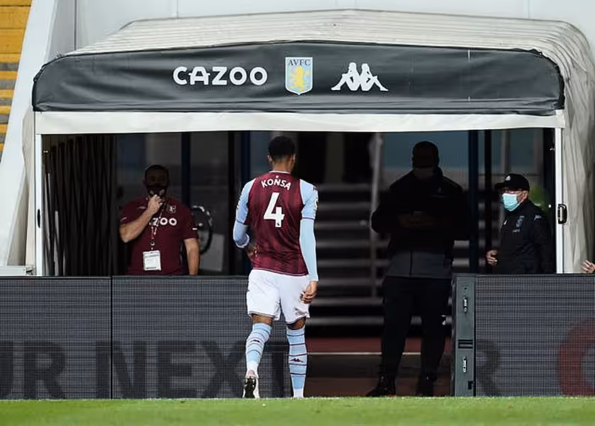 Ezri Konsa walks down the tunnel after his red card