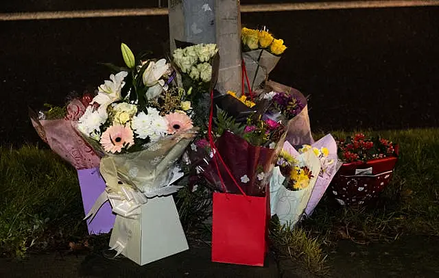 Floral tributes at the scene of a road crash