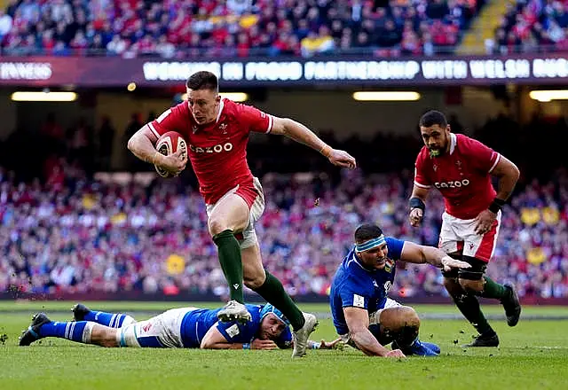 Josh Adams breaks away to score Wales' third try 