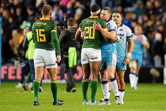 Scotland and South Africa players embrace following the international at Murrayfield