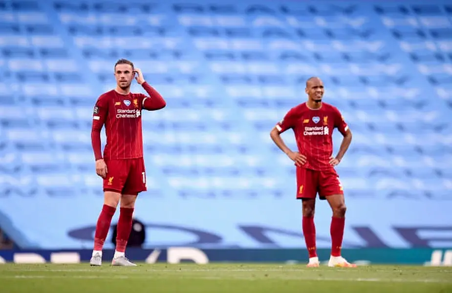 Liverpool midfielders Jordan Henderson and Fabinho together on the pitch