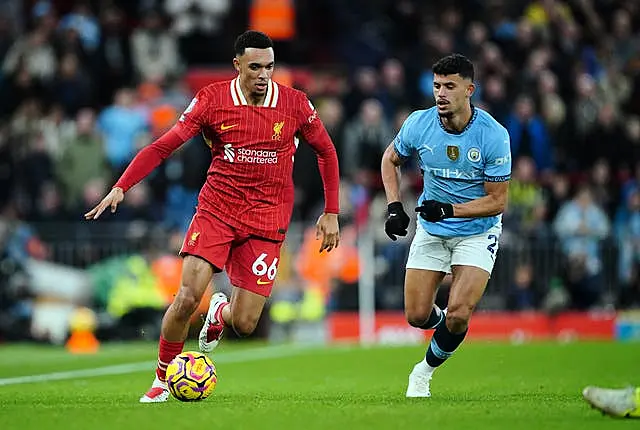 Liverpool’s Trent Alexander-Arnold runs with the ball in a game against Manchester City