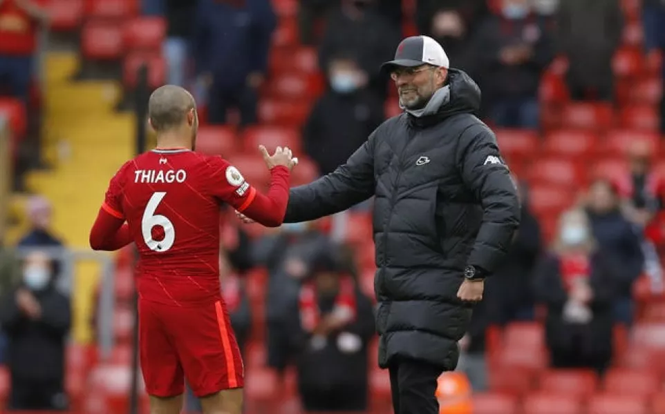 Liverpool midfielder Thiago Alcantara is congratulated by manager Jurgen Klopp
