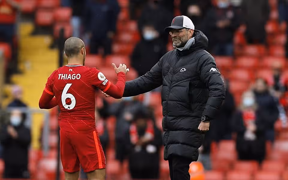 Liverpool midfielder Thiago Alcantara is congratulated by manager Jurgen Klopp