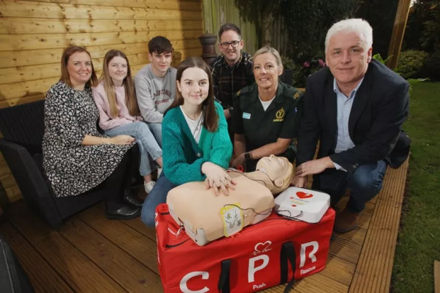  Lucy King (centre) with family mum Nicola, dad Richard, brother Thomas, sister Olivia and Stephanie Leckey, Community Resuscitation Lead with NIAS and Fearghal McKinney, Head of BHF NI (BHF Northern Ireland/PA)