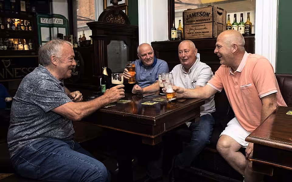 Drinkers celebrate in Slattery's Bar, Dublin
