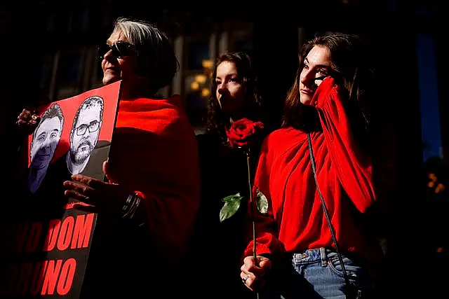 The niece of Dom Phillips, Domonique Davies (right), shows her emotion as she takes part in a vigil outside the Brazilian Embassy in London last month