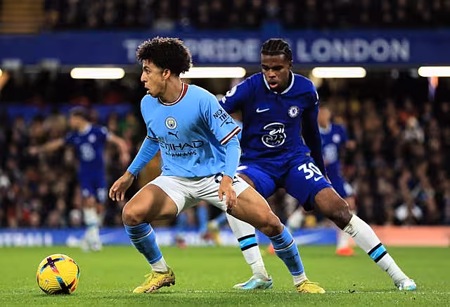 Rico Lewis, left, impressed for City