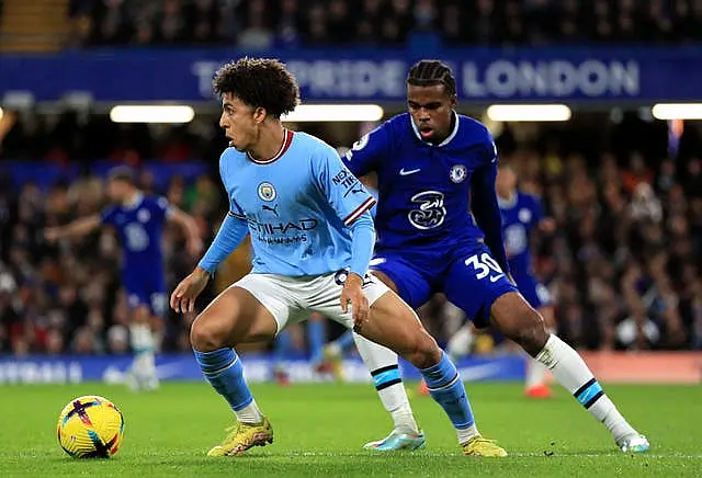 Rico Lewis, left, impressed for City