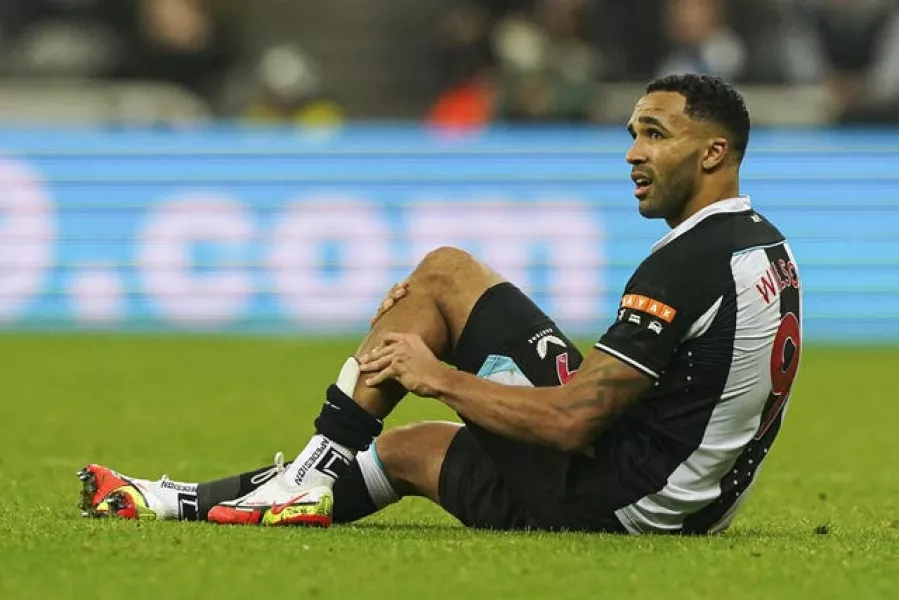 Newcastle United’s Callum Wilson on the ground holding his leg because of an injury during the Premier League match at St. James’ Park, Newcastle. 
