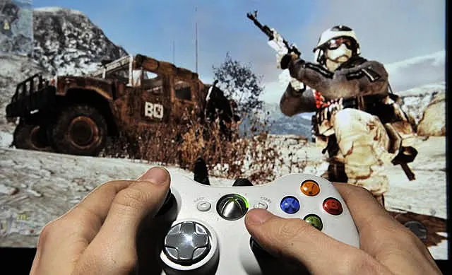 A person plays Call Of Duty Modern Warfare 2 on Microsoft's XBox 360